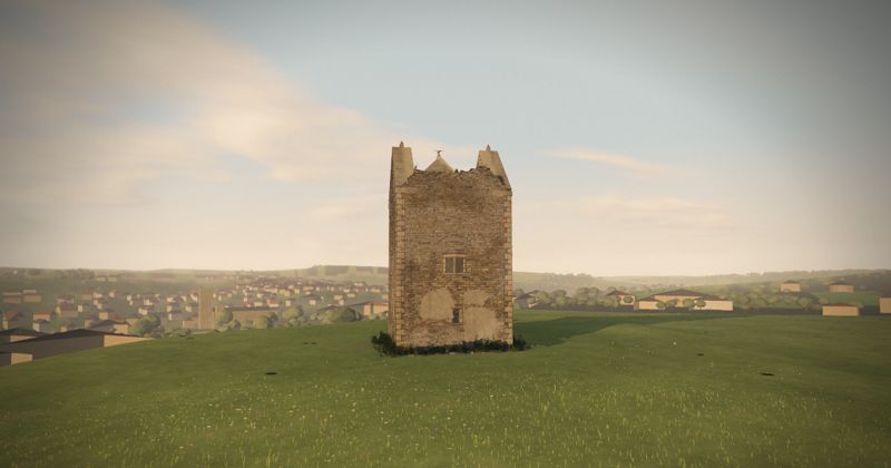 The Bruton Dovecote tower on Lusty Hill at golden hour, with the town below